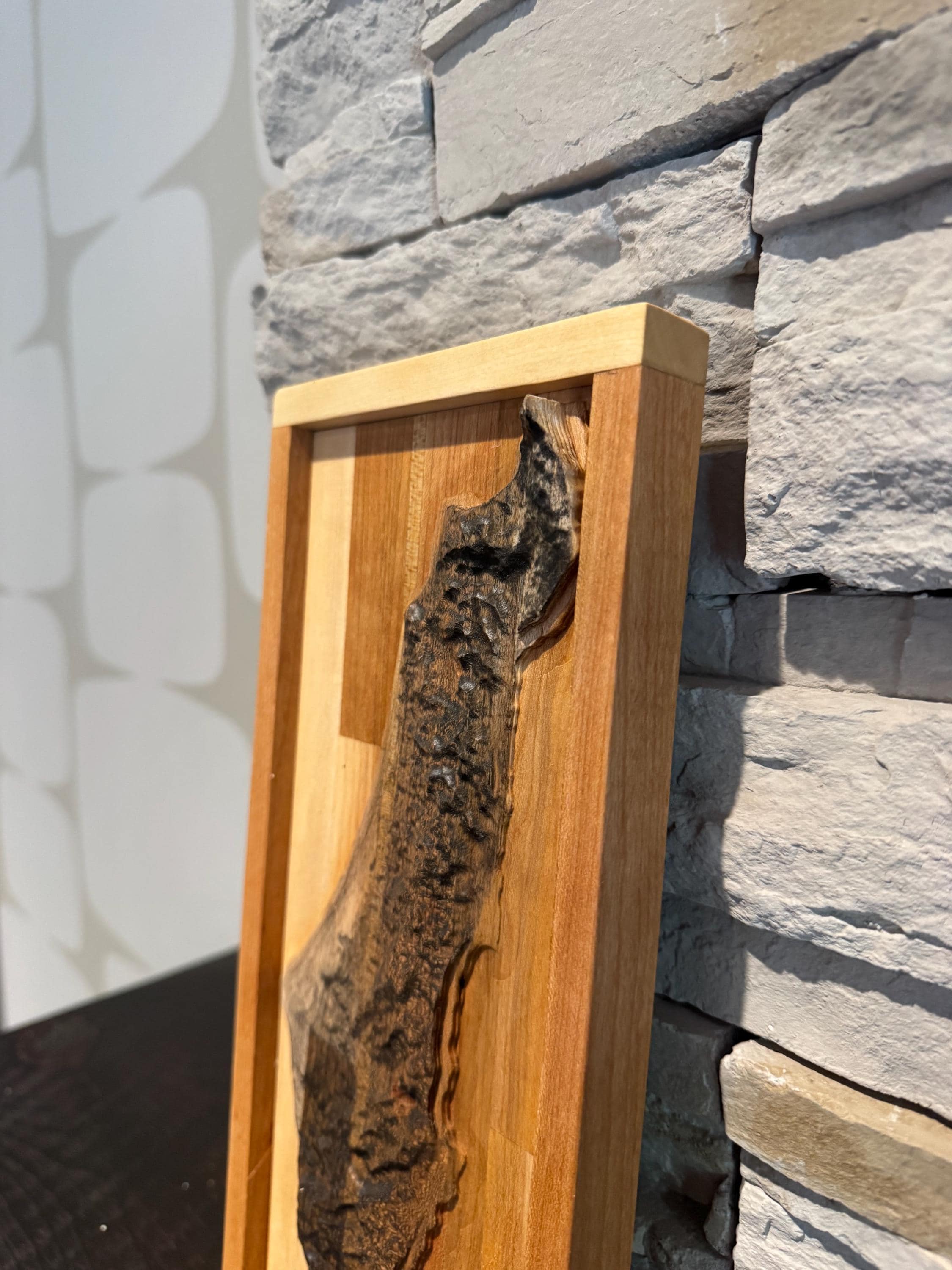 A close-up view focusing on the upper section of the topographical map, showcasing the intricate texturing of the wood that represents the mountain ranges and valleys. __etsy:8156429870