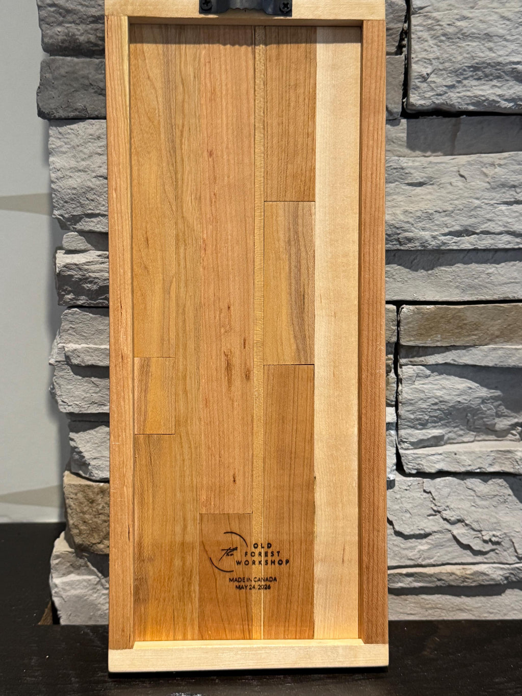 The flat back side of the wooden map of Israel, showcasing a clean, smooth wood finish and a stamped "The Old Forest Workshop - Made in Canada" maker's mark logo in the center. __etsy:8204353939