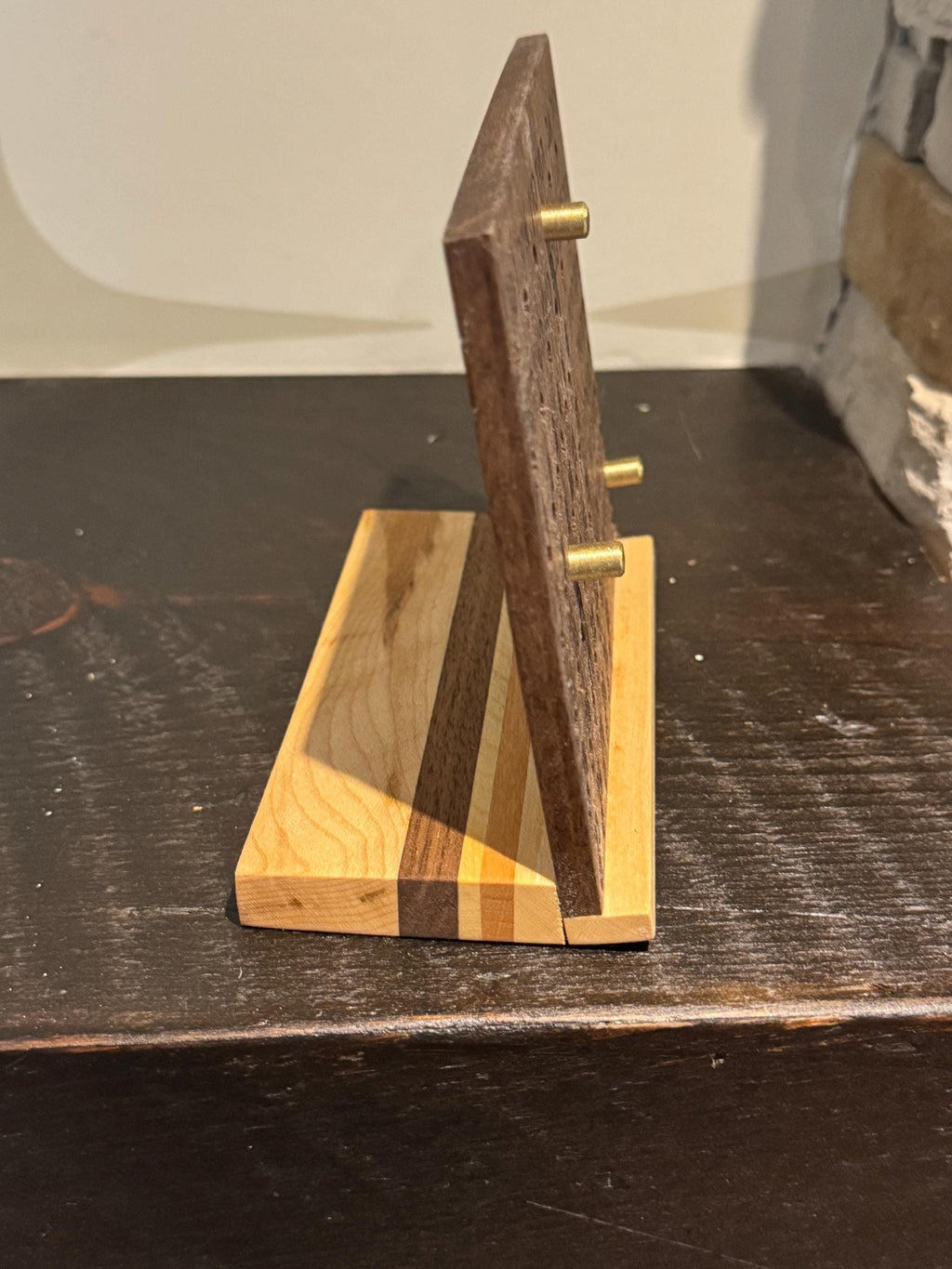 Direct side-profile view of a wooden desk calendar, displaying its slim silhouette and the angle of the back support piece. __etsy:8156632322