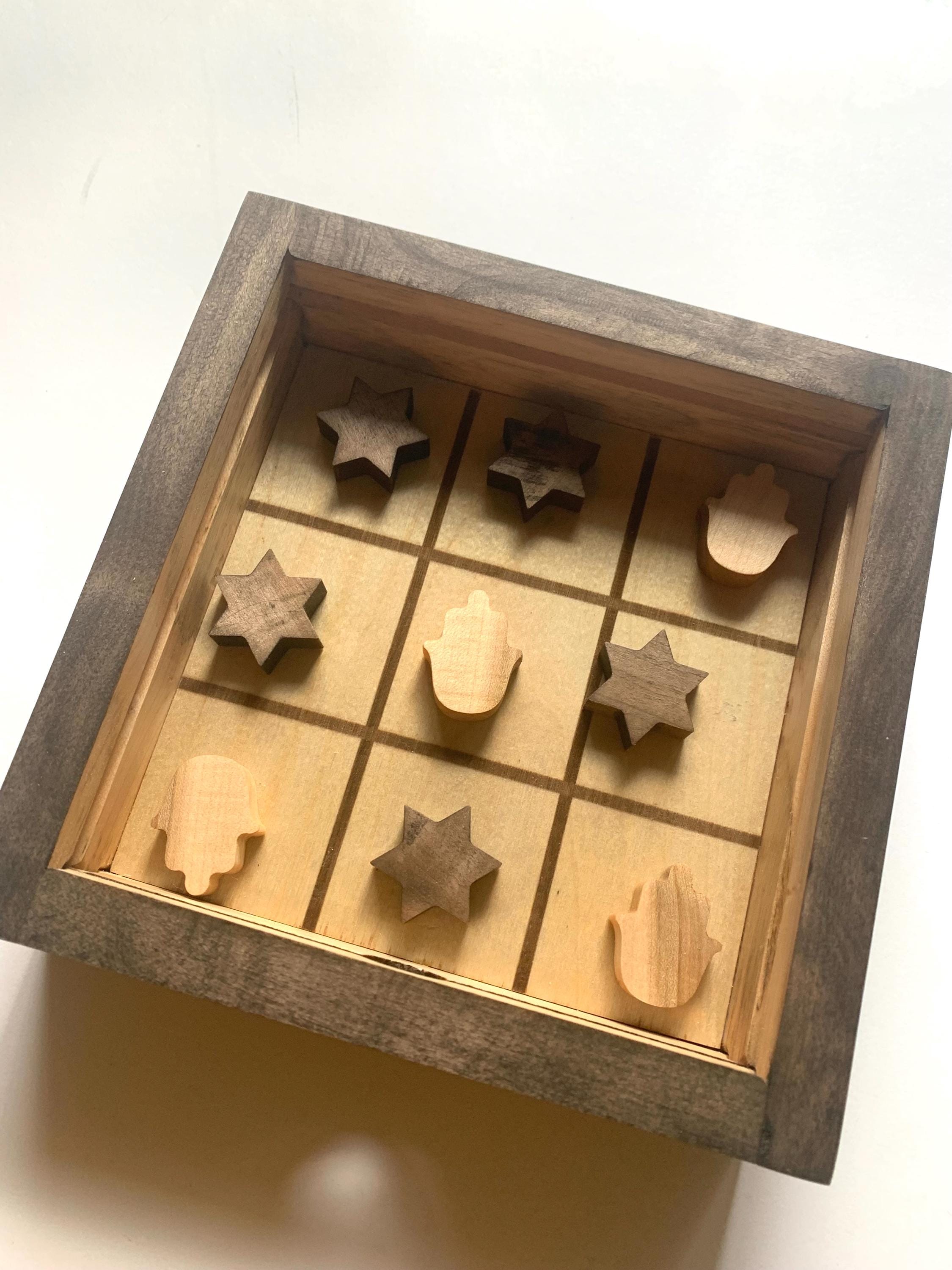 Game of Tic Tac Toe made out of wood, with acrylic cover and two toned pieces in the shape of hamsas and stars of david __etsy:6598336456