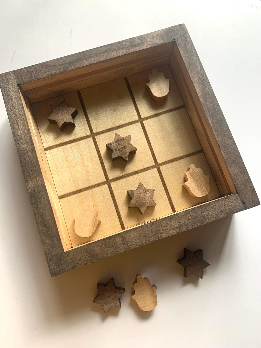 Game of Tic Tac Toe made out of wood, with acrylic cover and two toned pieces in the shape of hamsas and stars of David __etsy:6646450895