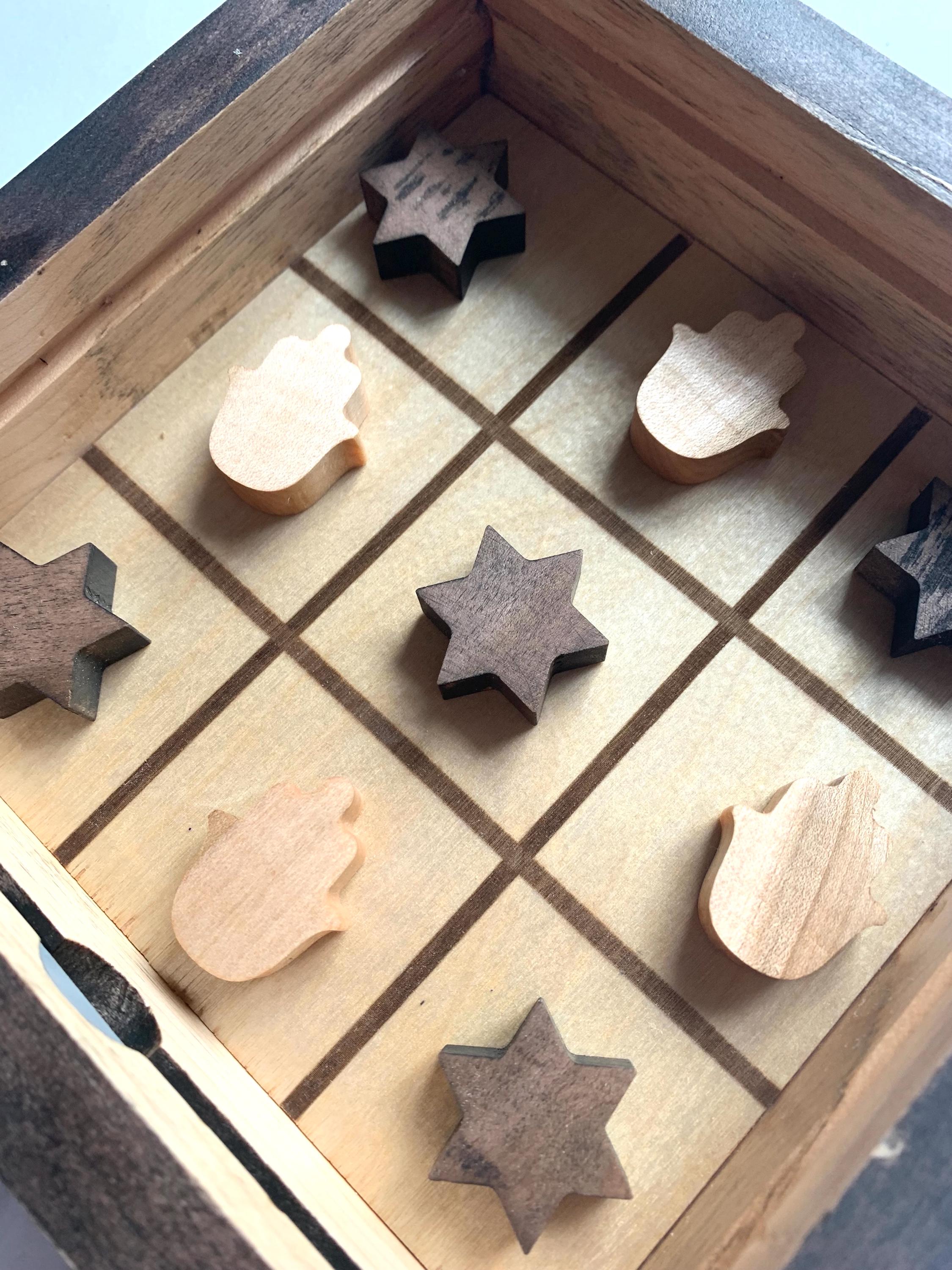 Game of Tic Tac Toe made out of wood, with acrylic cover and two toned pieces in the shape of hamsas and stars of David __etsy:6646451247