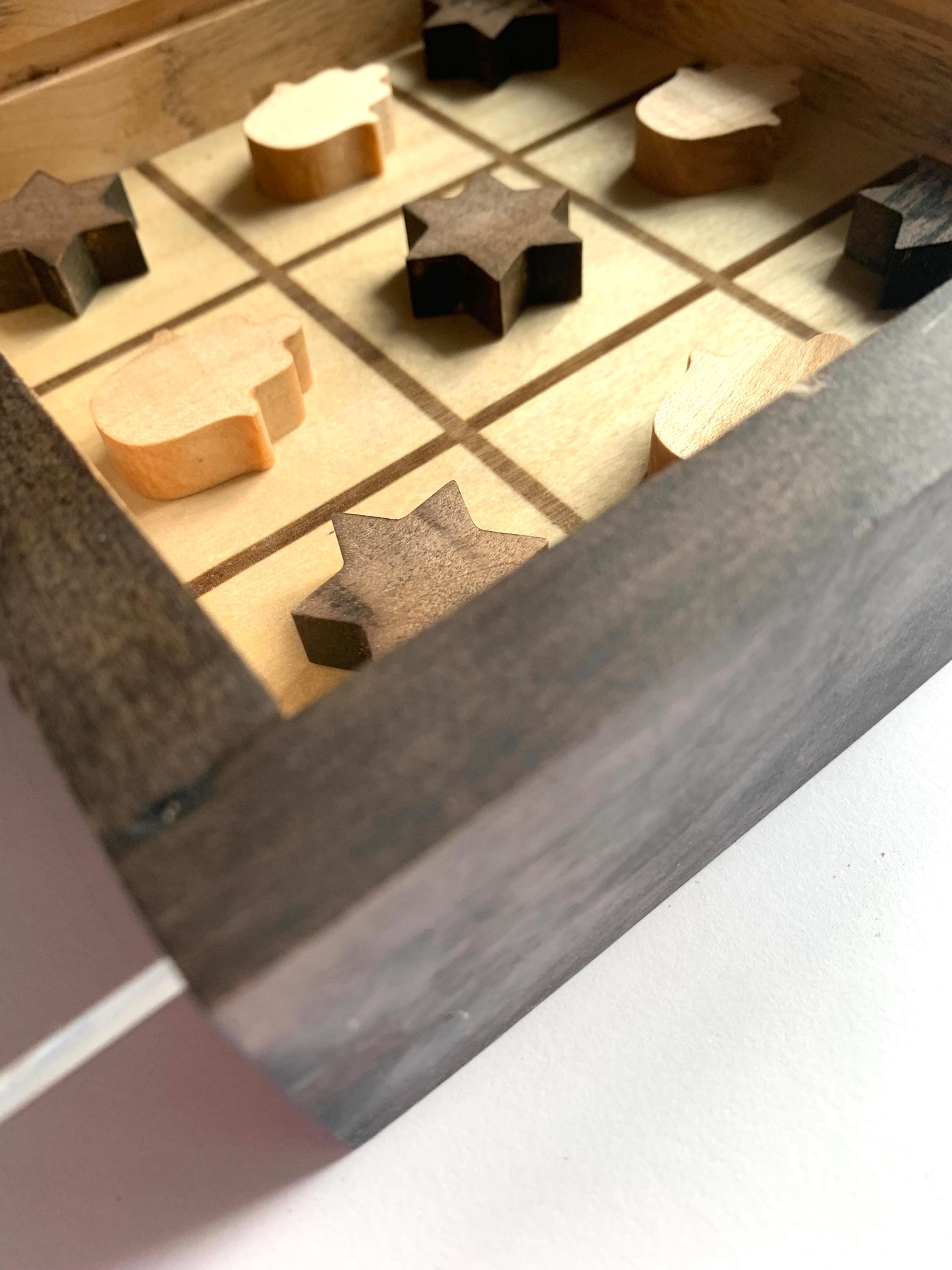 Game of Tic Tac Toe made out of wood, with acrylic cover and two toned pieces in the shape of hamsas and stars of David __etsy:6598337866